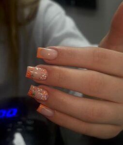 Autumn acrylic nails at Be Beautiful Preston with pumpkin French tips