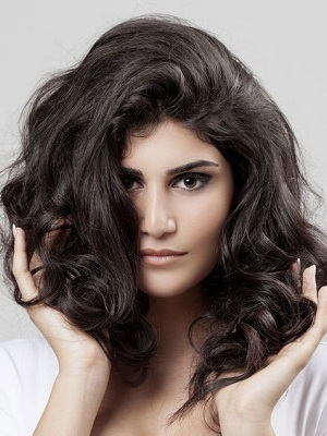 Beautiful Brunette Woman. Curly Long Hair.